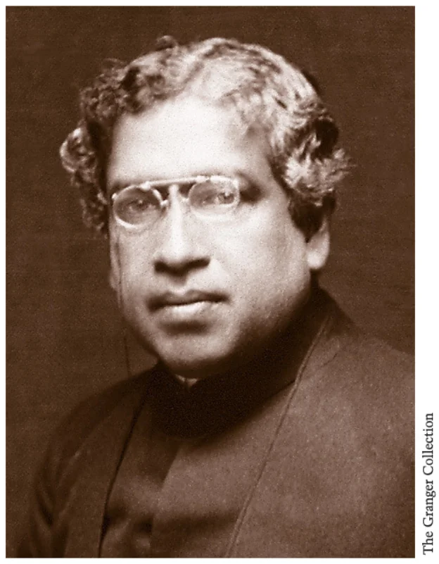 Retrato de Jagadis Chandra Bose con gafas y traje formal.
